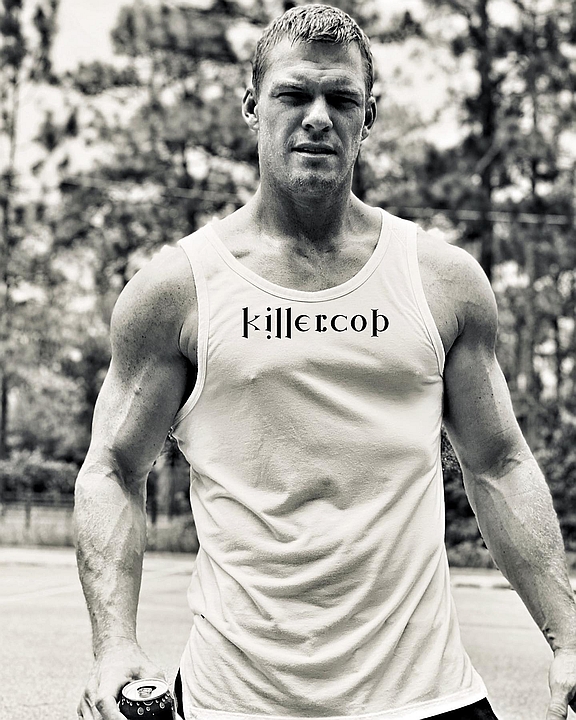 Reacher wearing a killer looking T-shirt.